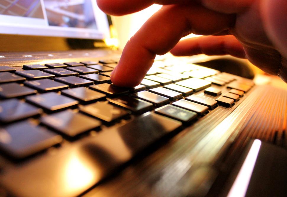 someone typing on a computer keyboard