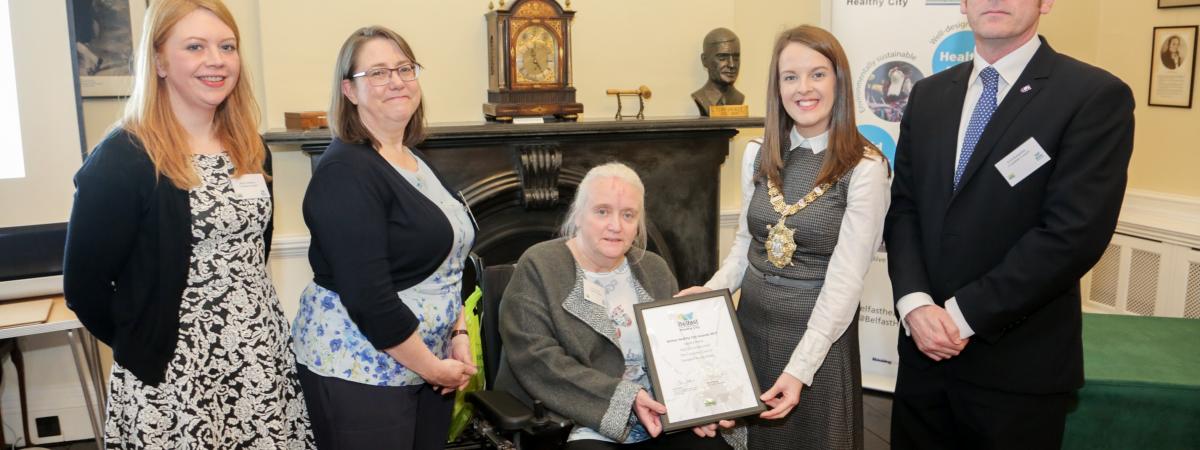 Jenny Robinson, Sinead Dynan and Scott Kennerley (The Consumer Council) and Vivien Blakely (IMTAC) are presented with 2017 WHO Belfast Health City Awards commendation by Lord Mayor Nuala McAllister.