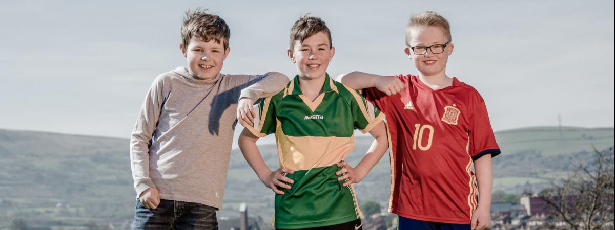 Boys photographed posing for the camera at Marrowbone Playing Fields, Oldpark Road, Belfast, Northern Ireland for a feature in Bout Yeh magazine