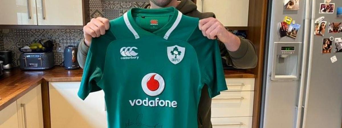 Rugby's John Cooney donated an Ireland jersey to raise much-needed cash for Cancer Focus NI.