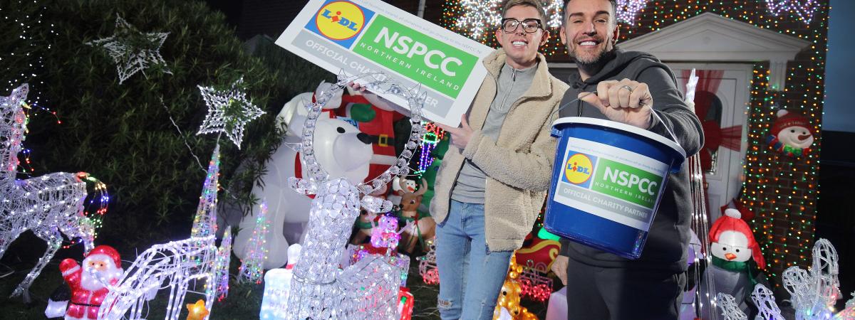 Two Men holding charity boxes
