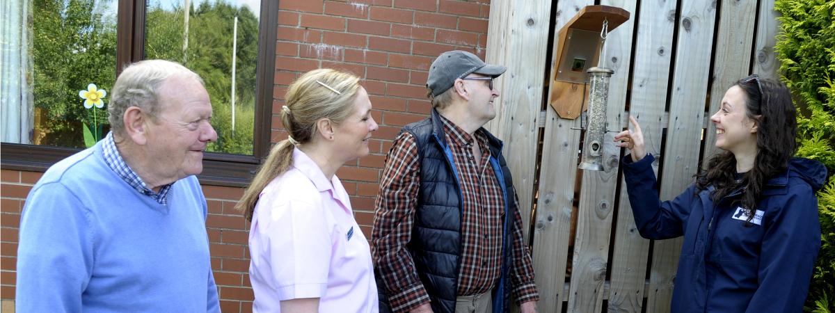 Inspecting the bird feeder and camera installed at Ann’s Lisnisky Care Home in Portadown are residents Bob Richardson and David Duprey with Personal Activities Leader, Julie Ann McStravick, and Ciara Laverty of Lough Neagh Partnership. www.loughneaghpartnership.org