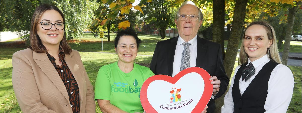 Edel Diamond of Colin Glen Christian Fellowship in Dunmurry receives the receive the James Brown & Sons Community Fund grant from James Brown MBE, Lisa Hutchinson, Funeral Arranger, and Emma Moore, Branch Development Manager, James Brown & Sons. Colin Glen Christian Fellowship which is part of the South West Belfast foodbank, will use the money to boost its food packages. www.jamesbrownfuneraldirectors.com 