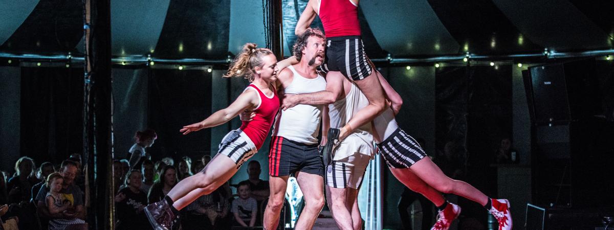 Tumble Circus performers create a stunning moving human pyramid. 