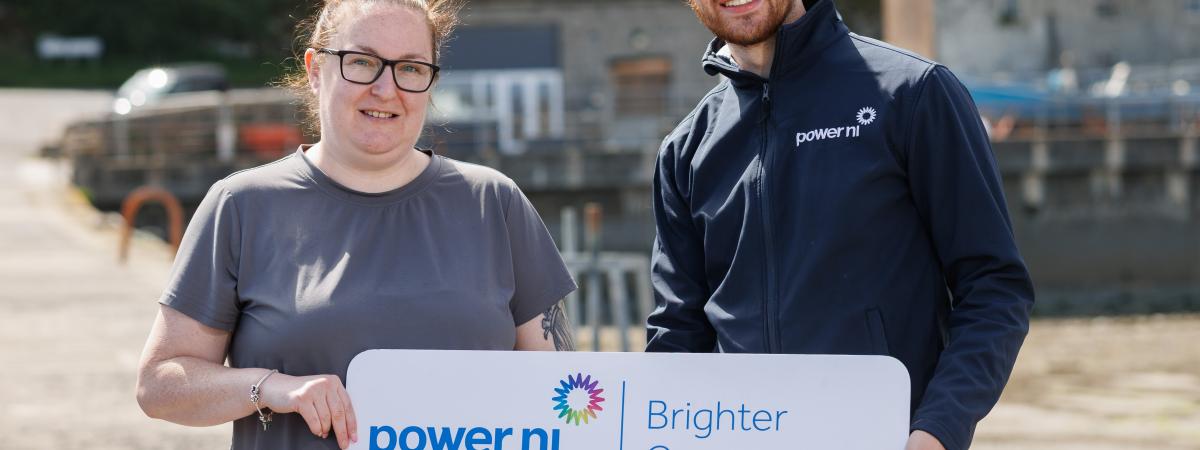 Shona Collins, charity secretary at Newcastle Harbour Heritage Association, pictured with Power NI representative Barry Rogan.