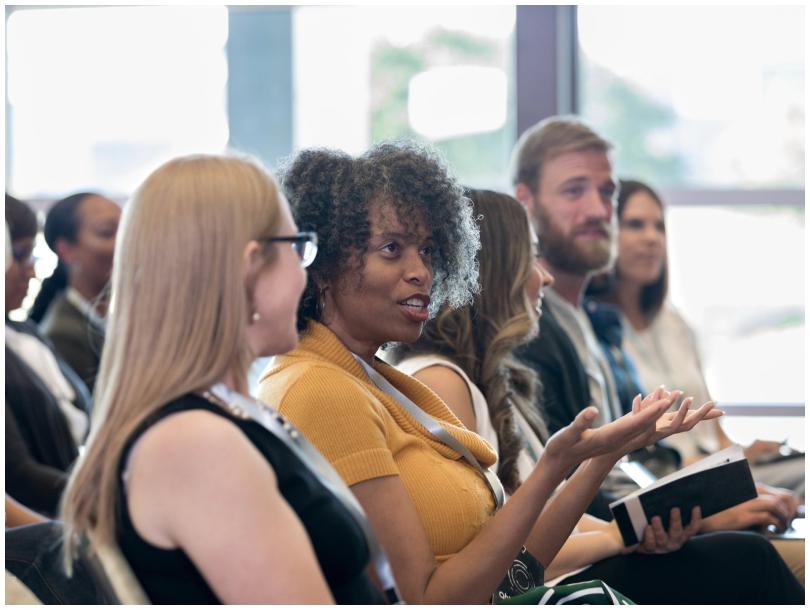 People talking at a conference