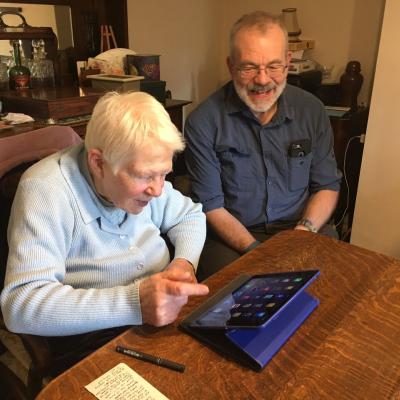 A volunteer visiting a disabled person at home