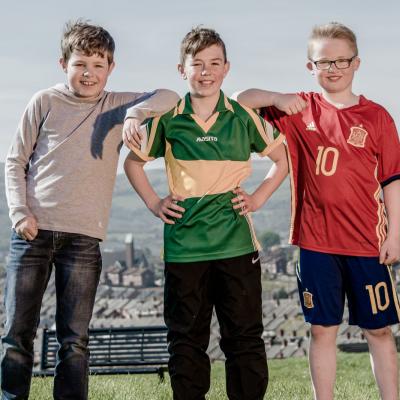 Boys photographed posing for the camera at Marrowbone Playing Fields, Oldpark Road, Belfast, Northern Ireland for a feature in Bout Yeh magazine