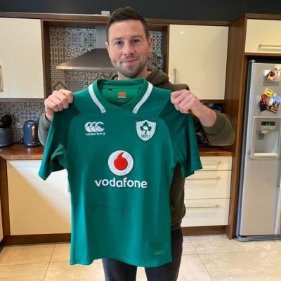 Rugby's John Cooney donated an Ireland jersey to raise much-needed cash for Cancer Focus NI.
