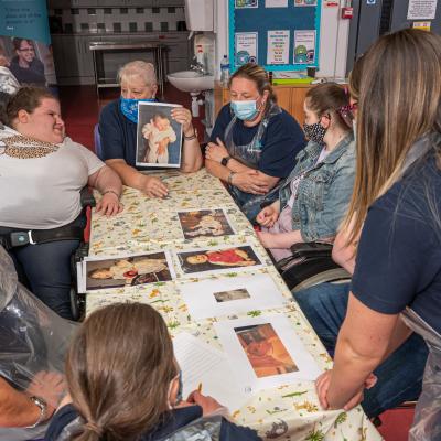 Young people participating in an activity session, picutred with volunteers and staff including Sandra McDonald and Lynne Morrison at Shaftsbury Community and Recreation Centre, Belfast