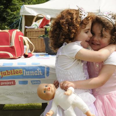 ​Jessica Kee enjoys her sister Sophie's company at The Big Jubilee Lunch during the Diamond Jubilee Celebration in Grey Point Fort, Helens Bay.