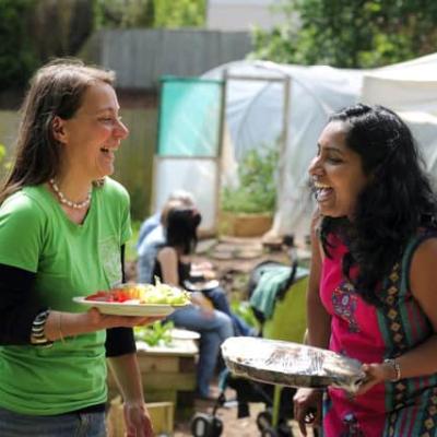 Two people eating lunch and looking happy