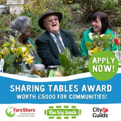 People celebrating at a table sharing food and laughing