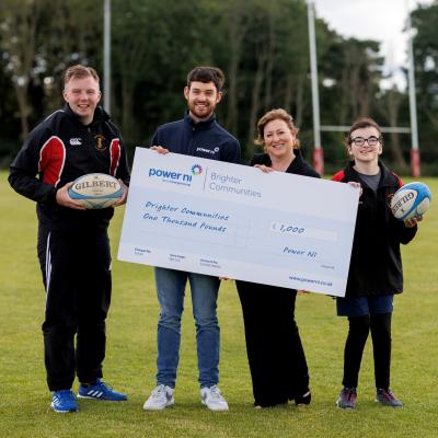 Pictured (L-R) is Newforge Taggers RFC captain Adam Smyth, Power NI representative Barry Rogan, Project Organiser Brenda Murphy and Under-15 player Rachel Bannon.