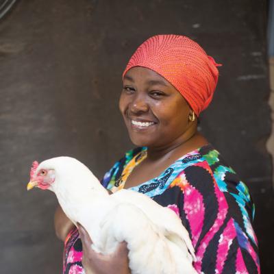 Khadija Kuroi from Machanga, Kenya, took part in a Self Help Africa programme - receiving improved breed birds to begin poultry breeding.